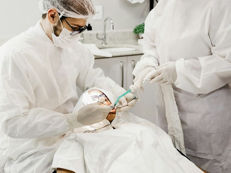 Dental surgeons performing a procedure